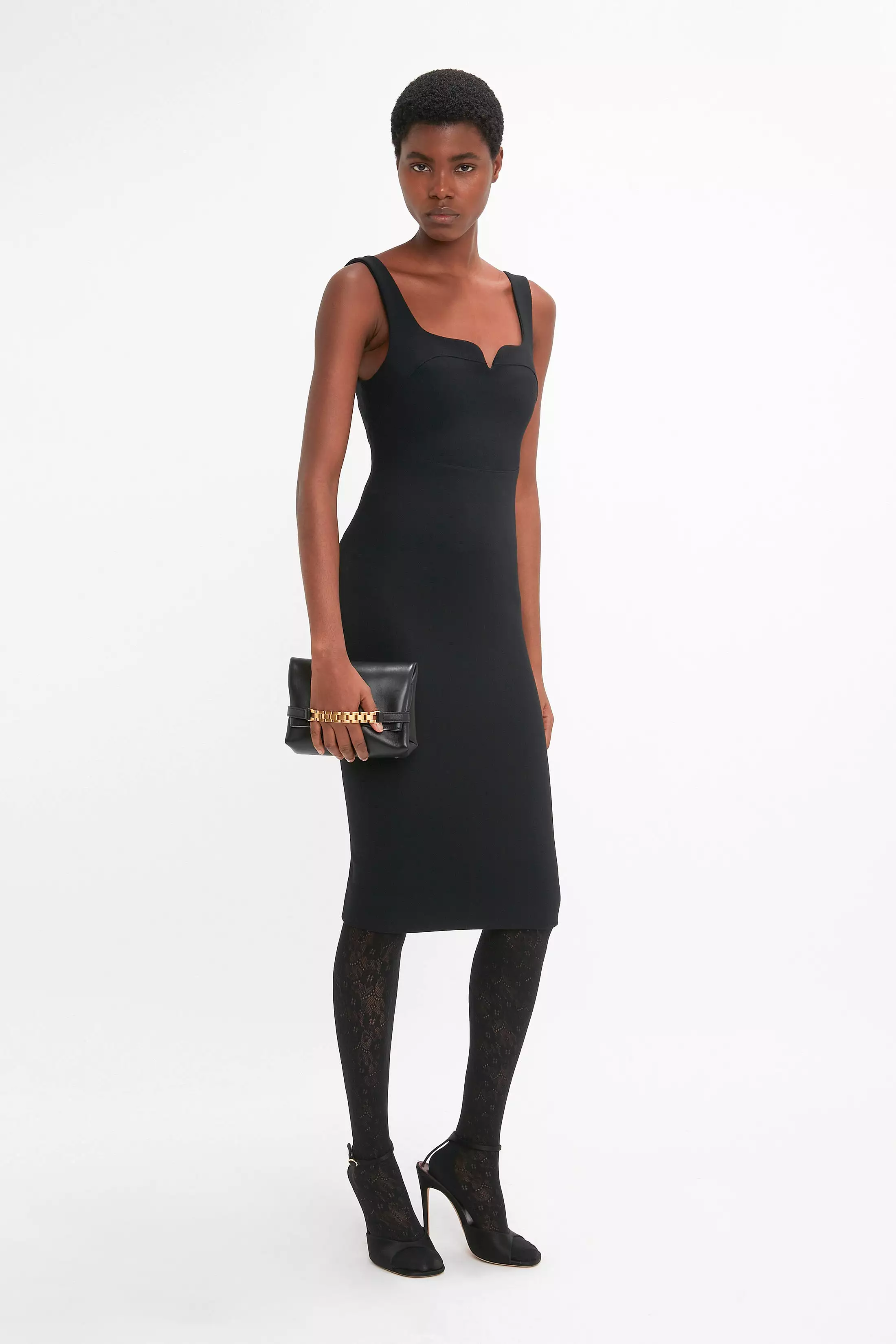 Black sleeveless fitted t-shirt dress.