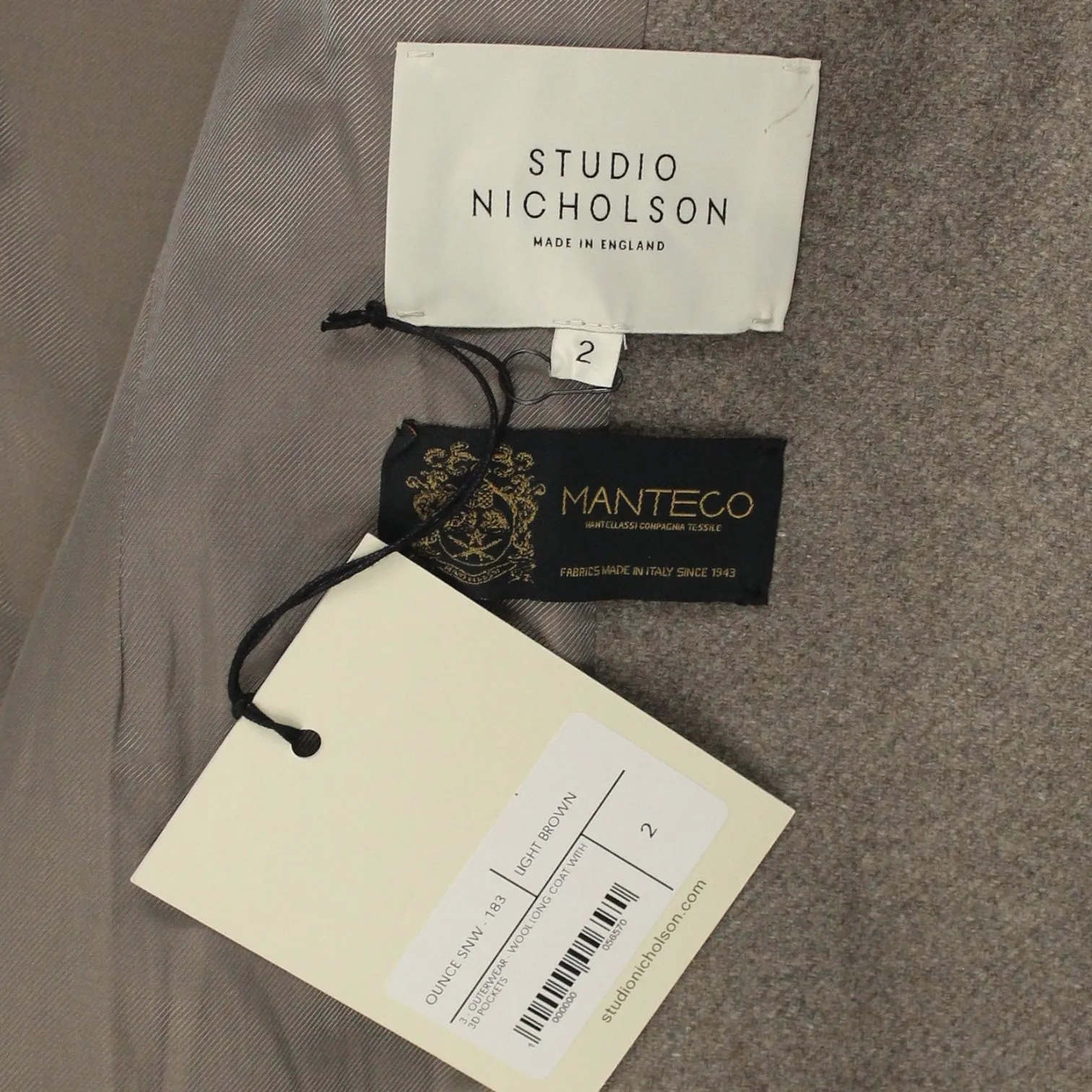 Brown 3D Pockets Long Coat by Studio Nicholson