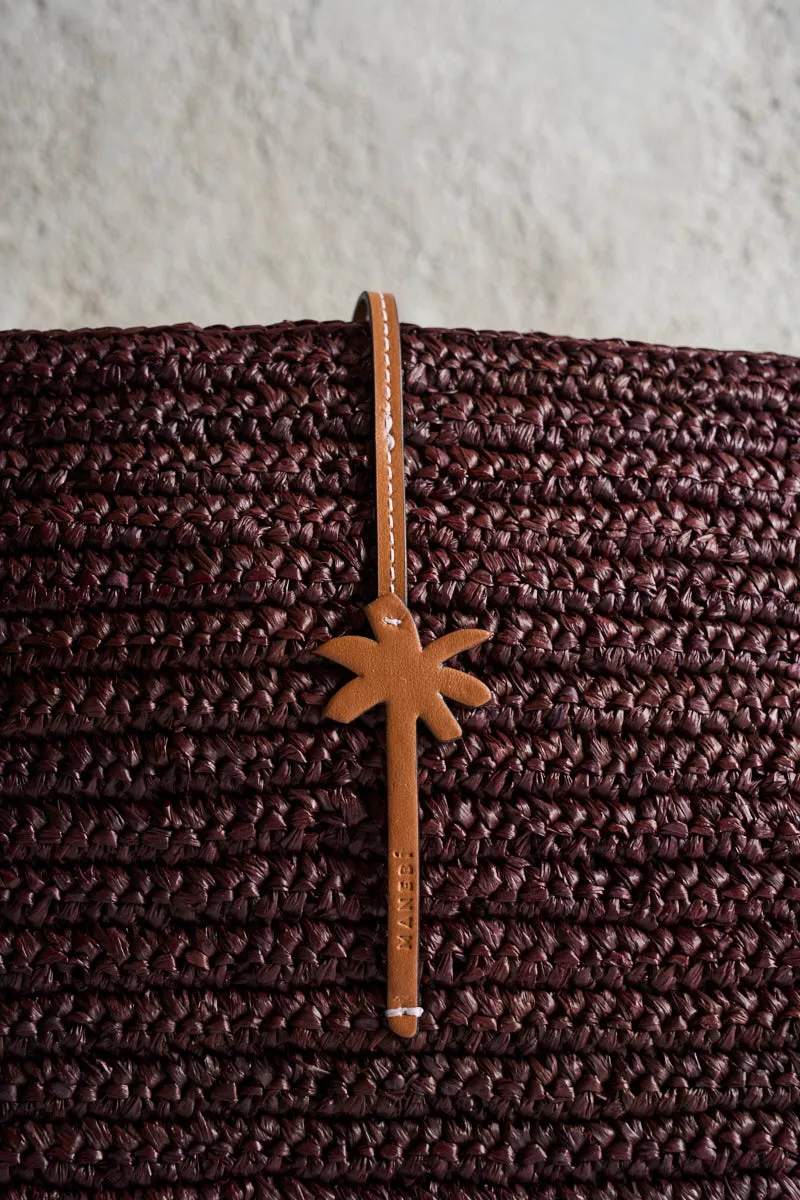 Brown raffia clutch bag.