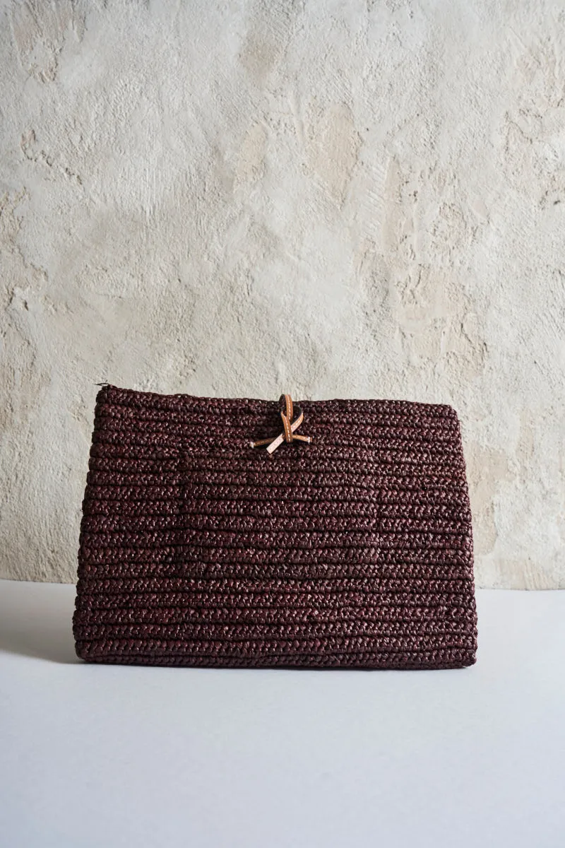 Brown raffia clutch bag.