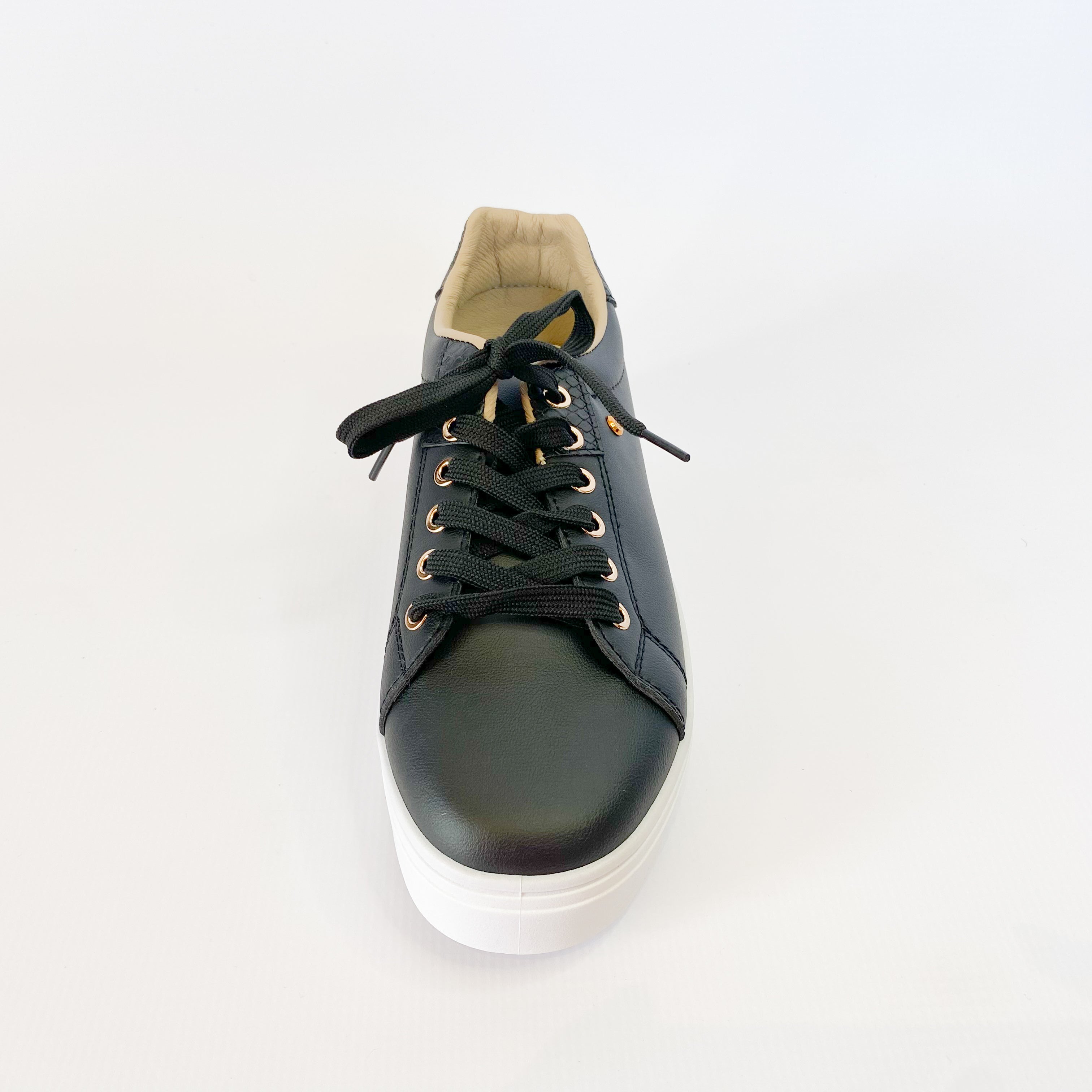 KG black sneaker with gold eyelet.