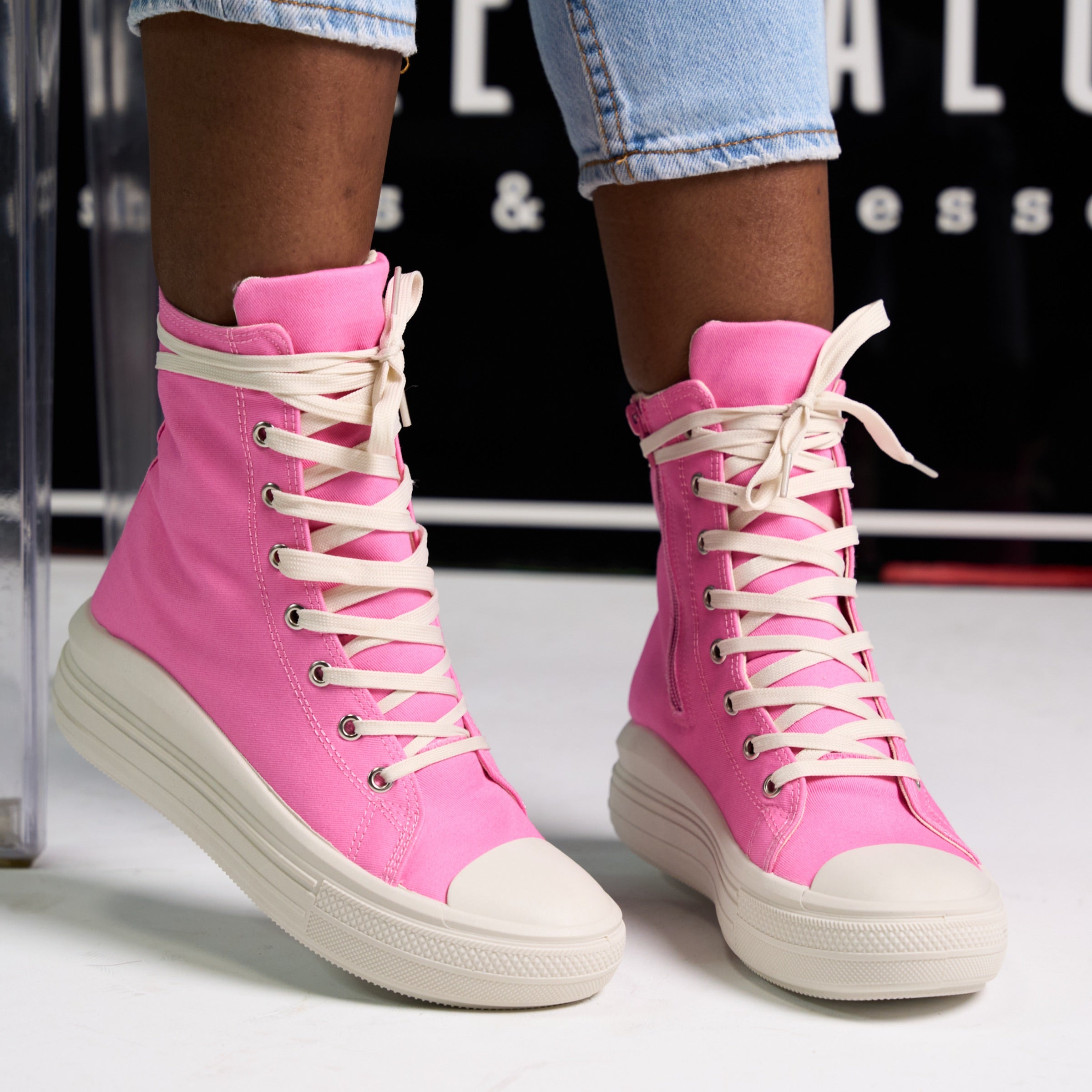 Results: Pink lace-up sneakers with extended design and swoosh logo